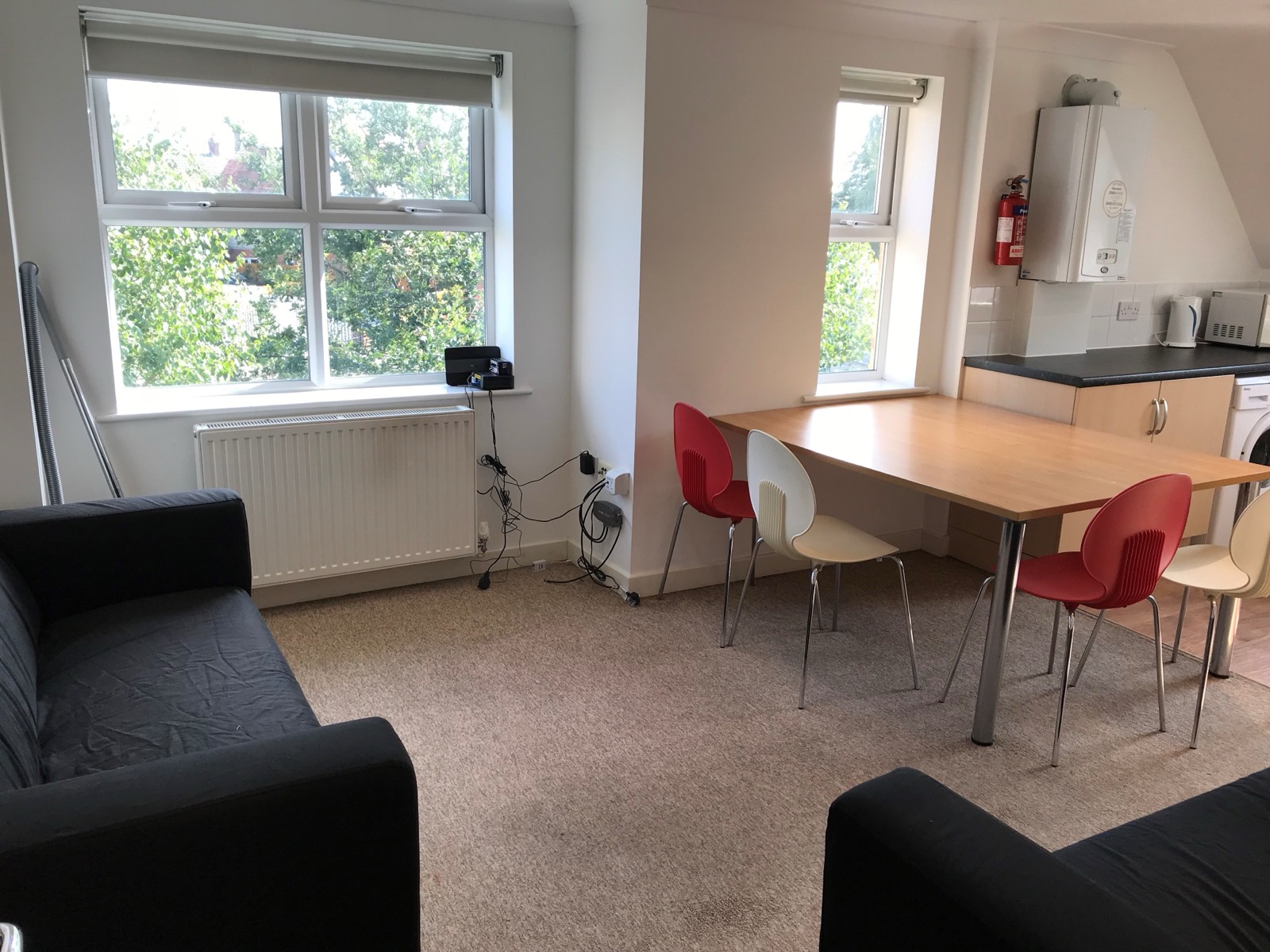 Open-plan living and kitchen in the three bedroom apartment at Conel Court